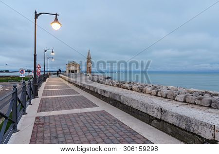 Colorfull Embankment In Caorle With The Church