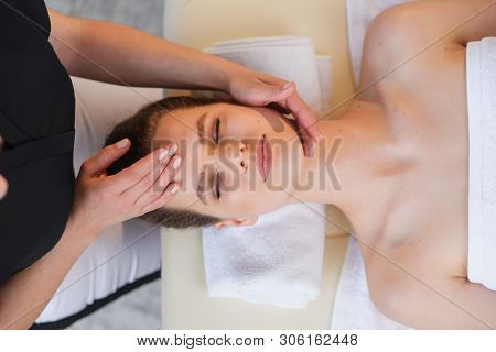 Young Female Masseur Making Massage For Young Client.