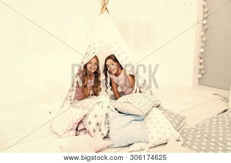 Girls Having Fun Tipi House. Girlish Leisure. Sisters Share Gossips Having Fun At Home. Cozy Place T