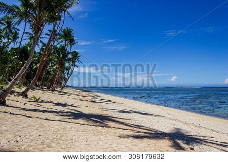 Beach On The Tropical Island Clear Blue Water. Dravuni Island, Fiji.