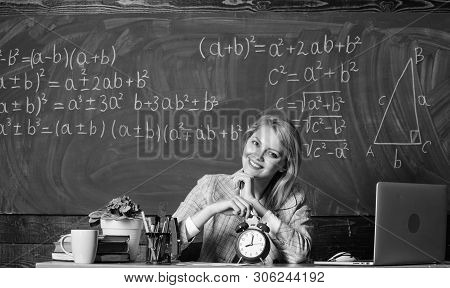 Take Your Time. Teacher With Alarm Clock At Blackboard. Time. Study And Education. Modern School. Kn