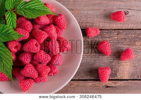 Sweet Fresh Organic Raspberries Background Close-up. Fresh And Sweet Raspberries Background