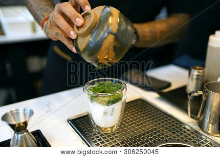 Iced Matcha Latte - A Glass Of Green Tea With Milk On The Table, Summer Refreshment Drinks.
