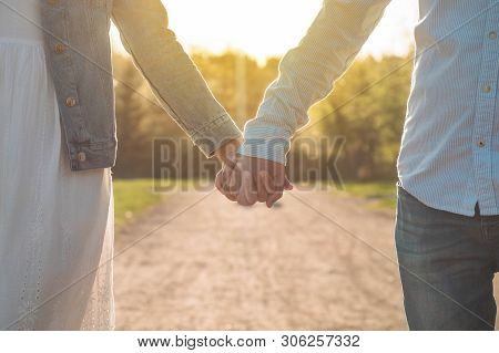 A Young Couple Spends Time Together Outdoors. Couple Having Fun Summer Time.