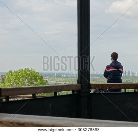Arbor And Observation Deck Overlooking The Dnieper On Vladimirskaya Gorka, Kiev. A Man Looks At The 