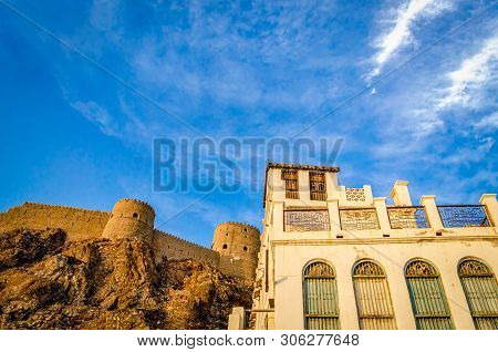 Majestic Muttrah Fort Adjacent To An Old And Abandoned House. From Muscat, Oman.
