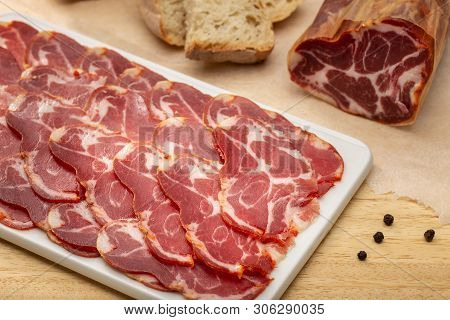 Sliced Loin On Ceramic Cutting Board
