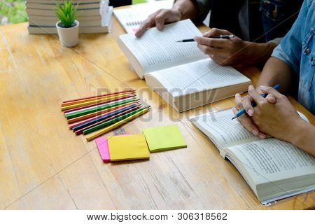 Woman And Man Work On The Table