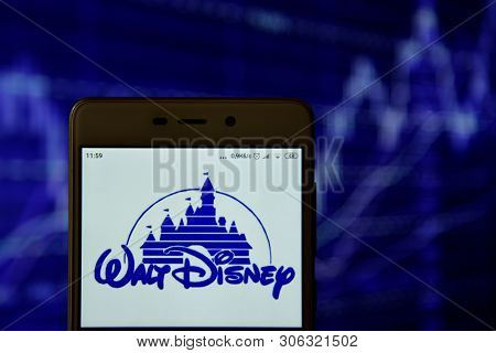 Walt Disney Logo Seen On The Smartphone