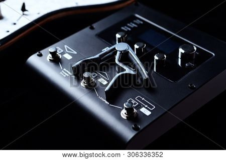 Multieffects Processor For Electric Guitar On Black Background.