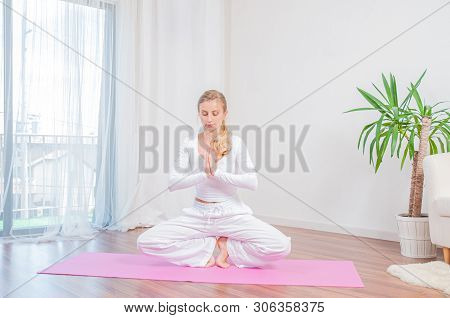 Yoga Time. Beautiful Woman Is Practicing Yoga At Home On Yoga Mat