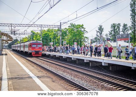 People Got Off The Train. . The Train Has Arrived. People Walk On The Platform. Russia, Leningrad Re