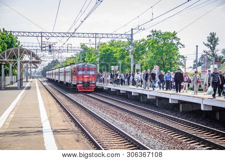 People Got Off The Train. . The Train Has Arrived. People Walk On The Platform. Russia, Leningrad Re