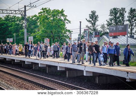 People Got Off The Train. . The Train Has Arrived. People Walk On The Platform. Russia, Leningrad Re