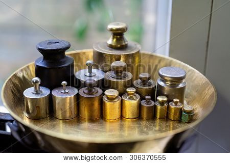 Rusty Weights On Balance Scale. Many Kind Of Traditional Iron Weighs Scale That Used In The Past. Is