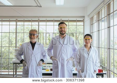 Group Of Scientists People Standing Together In Laboratory,successful Teamwork And Reserch Working