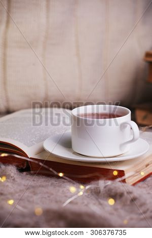 Hot Tea And Book With Woolan Plaid On Wood Background - Seasonal Relax Concept. Autumn Winter Weeken