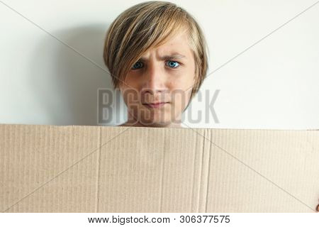 Boy Showing Blank Signboard with Empty Copyspace