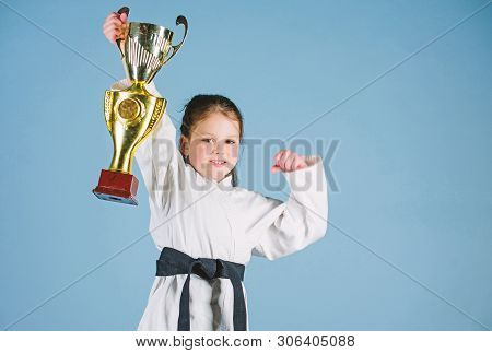 Sport Success In Single Combat. Practicing Kung Fu. Happy Childhood. Winner Little Girl In Gi Sports