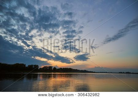 Beautiful Sunset Over The White River With Clouds Reflected In The Water. Bashkiria, Russia