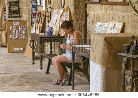 Cyprus, Nicosia - June 10, 2019: Portrait Of A Young Female Crochet Knitter Sitting And And Working 