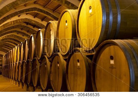Vintage Wine Cellar With Old Oak Barrels, Production Of Fortified Dry Or Sweet Marsala Wine In Marsa