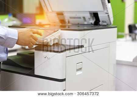 Men Press The Button Of The Copier. Man Copying Paper From Photocopier. Men Use Printing Machines. T