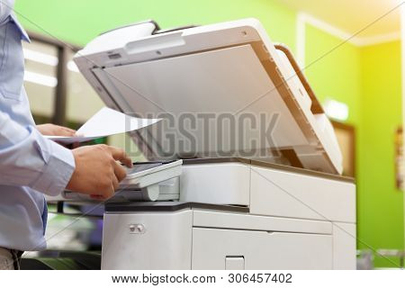 Men Press The Button Of The Copier. Man Copying Paper From Photocopier. Men Use Printing Machines. T