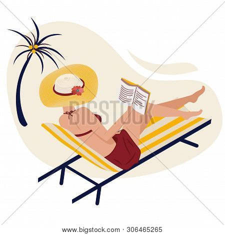 Girl In Summer On The Beach Reads. A Woman Is Lying In A Striped Chaise Lounge In A Fashionable Stri