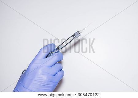 Sterile Carpool Syringe With A Needle For Local Anesthesia In The Hand Of A Dentist. Local Anesthesi