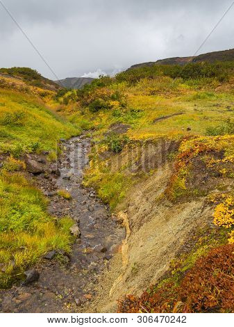 View Of The Eastern Mountain Covered By Clouds, Jelizevo District, Peninsula Kamchatka. Stream Flowi