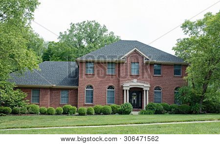 Massive Federal Red Brick House with Bushes