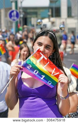 The Annual Parade Lgbt. Girl Lesbian In The Gay Pride Parade. Parade Of Tolerance. Rainbow Flags At 