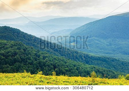 Green Mountain Background On A Cloudy Forenoon. Forested Hill Rolling In To The Distant Mountain Rid