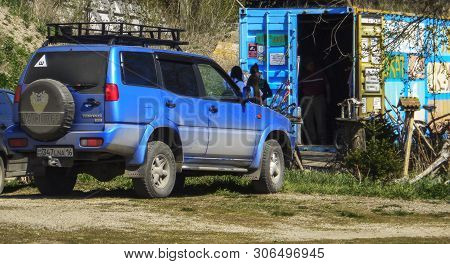Kazakhstan, Ust-kamenogorsk, May 5, 2019: Nissan Terrano Ii. Metal Container. People. Business