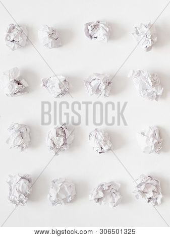 Waste Reduction. Flat Lay Of Crumpled Paper Ball Rows On White Surface. Abstract Background.