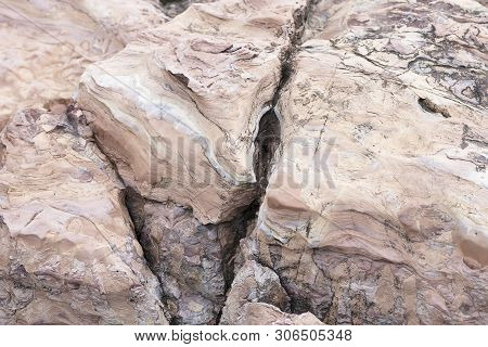 The Rock Is Red With A Fault In America. The Crack In The Stone, A Piece Of A Broken Stone Brown Col