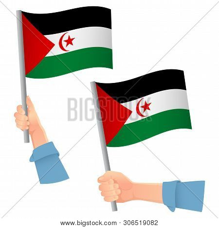 Sahrawi Arab Democratic Republic Flag In Hand. Patriotic Background. National Flag Of Sahrawi Arab D