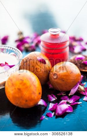 Face Pack For Cheeks On Wooden Surface Consisting Of Sapodilla Or Chikoo Well Mixed With Sandalwood