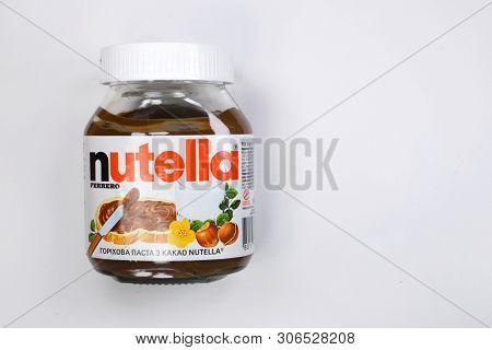 Kyiv, Ukraine - May 27, 2019: Nutella introduced to the market in 1964 by Italian company Ferrero. Nutella hazelnut on white background