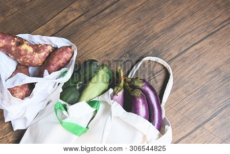 Zero Waste Use Less Plastic Concept / Fresh Vegetables Organic In Eco Cotton Fabric Bags On Wooden T