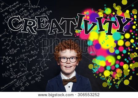 Crearivity Concept. Smart Child Student On Blackboard Background