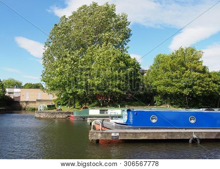 Old Narrow Boats Converted To Houseboats Moored In The Marina At Brighouse Basin In West Yorkshire S