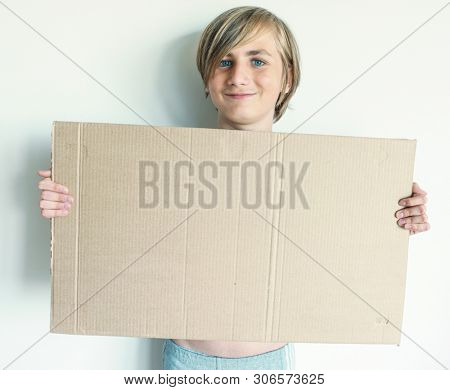 Boy Showing Blank Signboard with Empty Copyspace