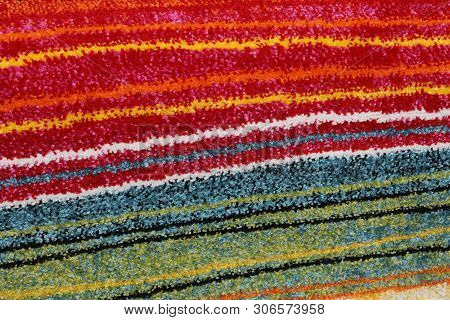 Background Of Chenille Rug With Colorful Lines Of Contrasting Fabric