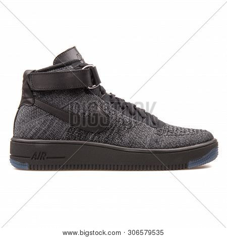 Vienna, Austria - August 10, 2017: Nike Air Force 1 Ultra Flyknit Mid Black And Grey Sneaker On Whit