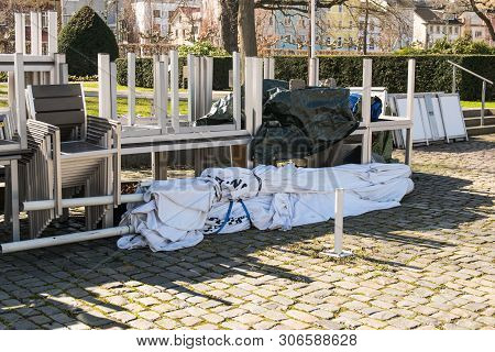 Warehouse On The Open Air. Chairs And Tables Outside On The Spring Sun Weather. Furnitureset And Umb