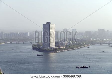 Pyongyang, North Korea - May 1, 2019: City View And Taedong River At Sunset. View On The Modern Yang