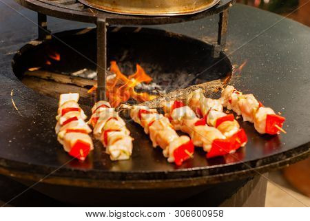 Small Satay Of Meat And Vegetables On Wooden Skewers Fried On A Brazier Close Up