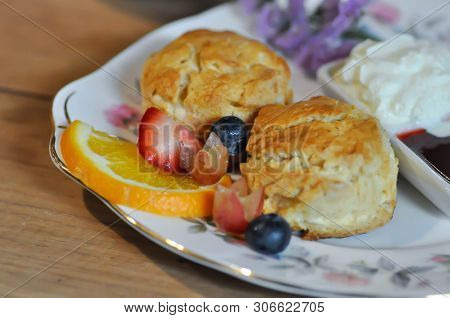 Scone Or Scone With Fruit ,whipping Cream And Sauce